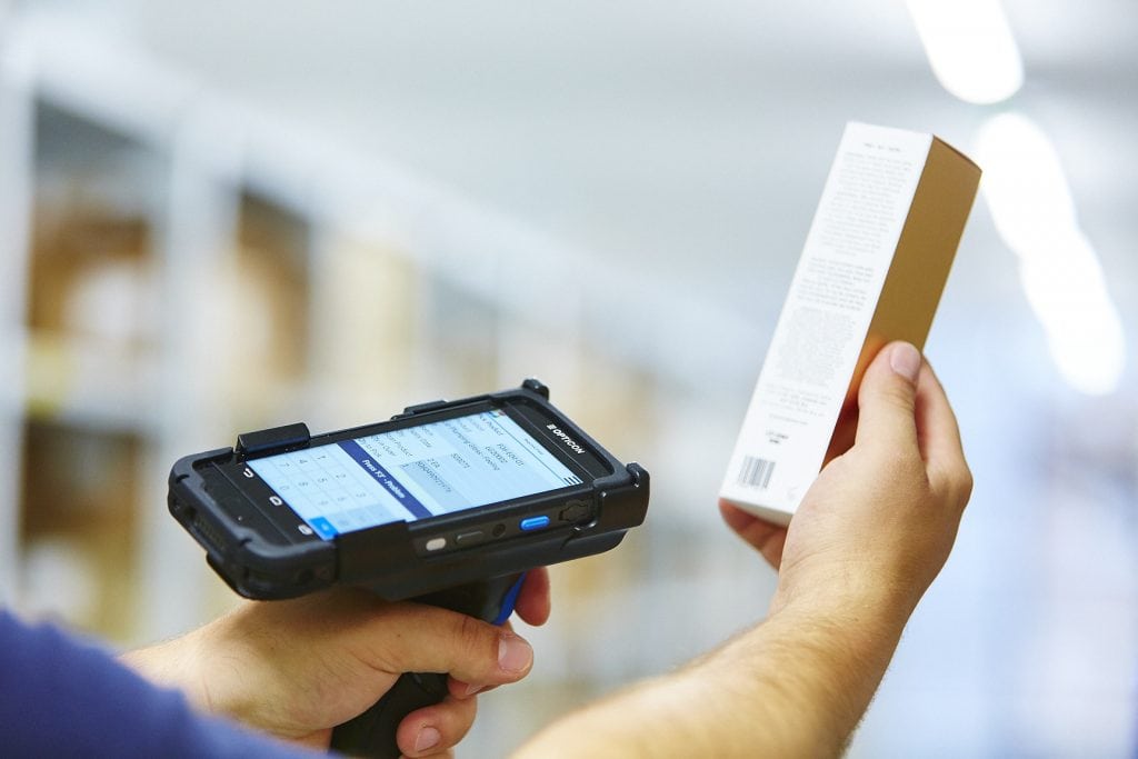 Warehouse employee scanning a barcode a product