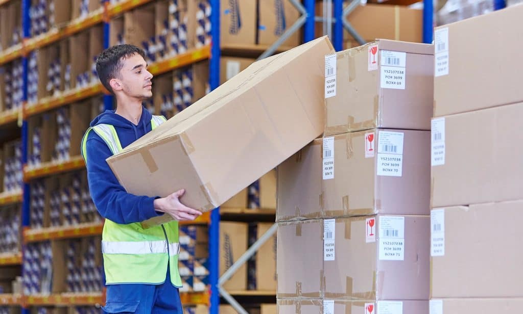 Warehouse man loading boxes